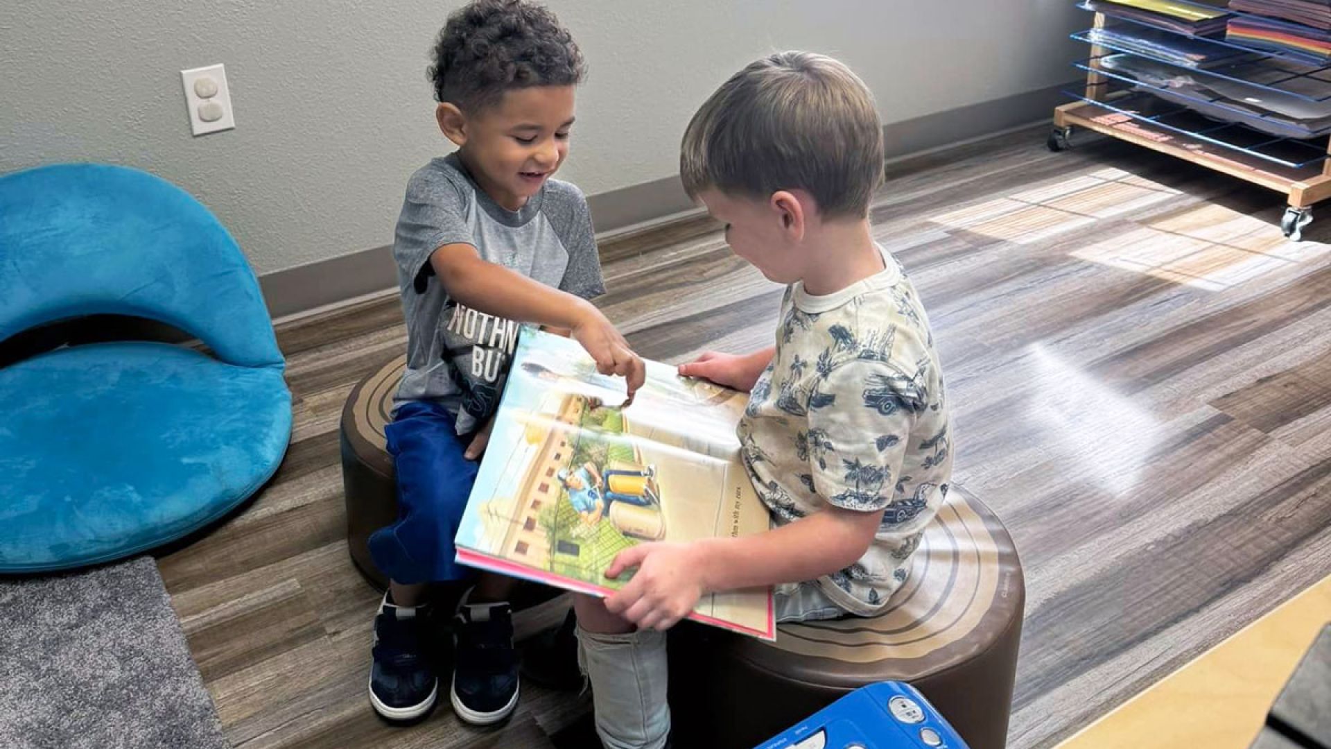 Children Reading Book at Pathways 2 Learning